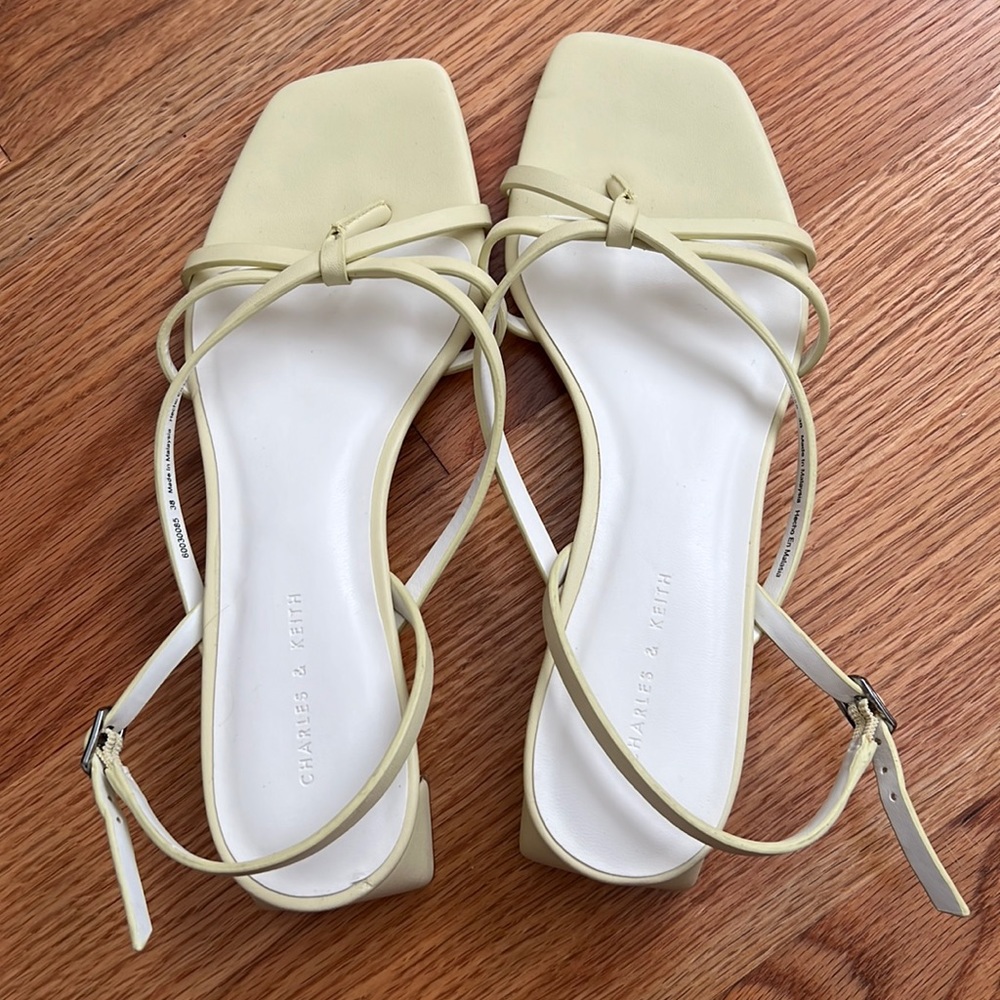 Yellow strappy heeled sandals
